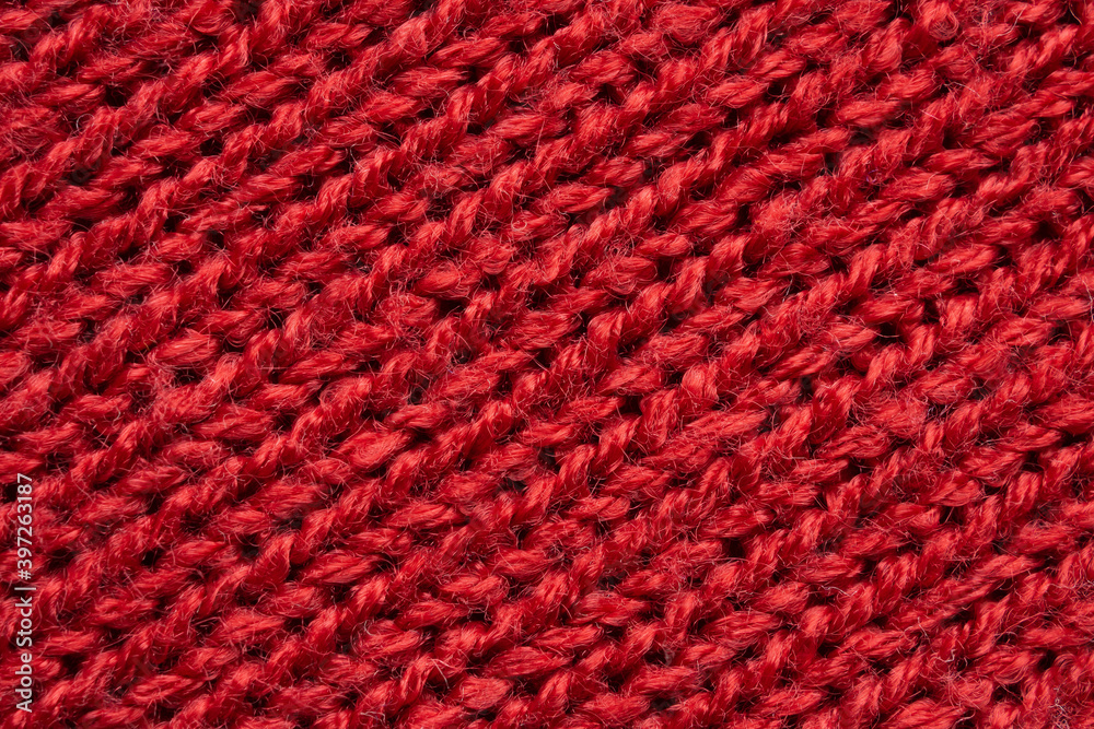 Red knitted wool texture background Red knitted wool texture background