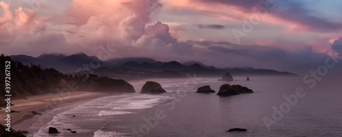 Cannon Beach, Oregon, United States. Beautiful Aerial Panoramic View of the Rocky Pacific Ocean Coast. Dramatic Colorful Sunrise Sky.