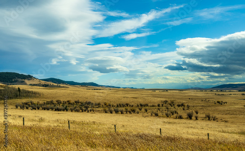 Country road, rural landscape in autumn season. Alberta Provincial Highway No. 22, also known as the Cowboy Trail. Alberta, Canada. photo