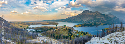 Panorama view of Town of Waterton Lakes National Park in beautiful dusk. Landscape scenery after Wildfire in 2020 autumn foliage season. Alberta, Canada. photo