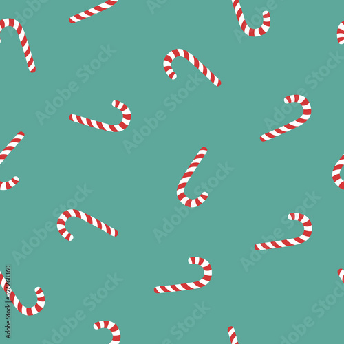 Vector seamless pattern with Christmas candy on green background. Christmas concept for wrapping  wallpaper or backdrop