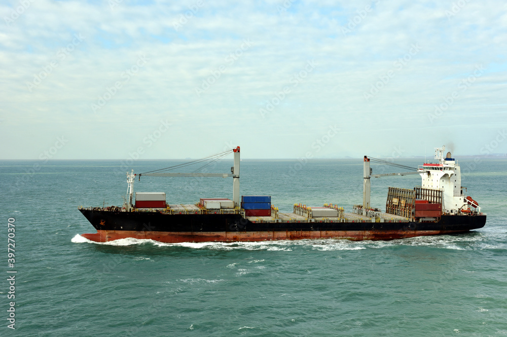 Container ship departing port of Xiamen, China. 