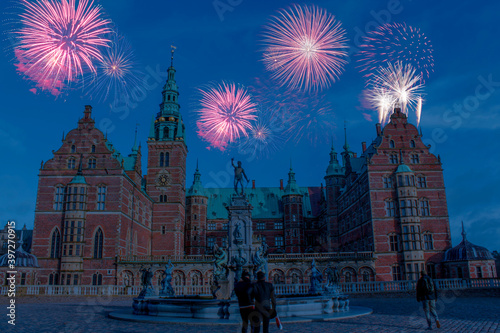 Celebratory fireworks for new year over Rosenborg Castle in Copenhagen, Denmark during last night of year. Christmas atmosphere