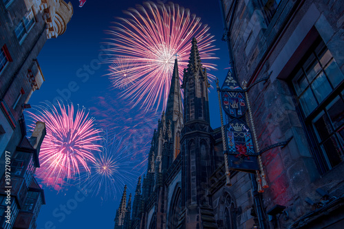Celebratory fireworks for new year over The Hub from the Royal Mile, previously Church of Scotland Highland Tolbooth St John's Church in Edinburgh during last night of year. Christmas atmosphere. 