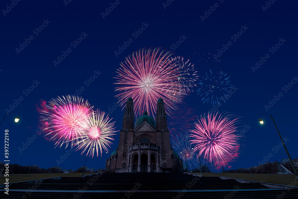 Celebratory fireworks for new year over Sacred Heart, Brussels - Belgium during last night of year. Christmas atmosphere
