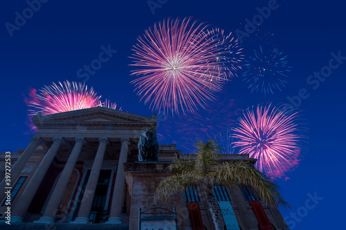 Celebratory fireworks for new year over massimo theatre palermo in italy  during last night of year. Christmas atmosphere. 
