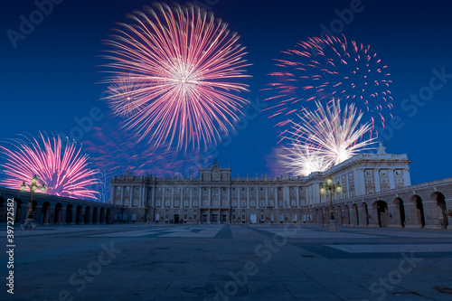 Celebratory fireworks for new year over the royal palace ( Palacio Real ) of Madrid , Spain during last night of year. Christmas atmosphere