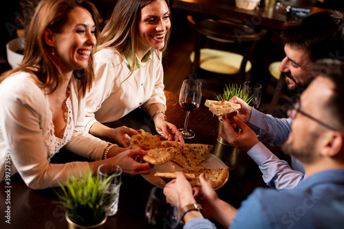 Young people having dinner ...