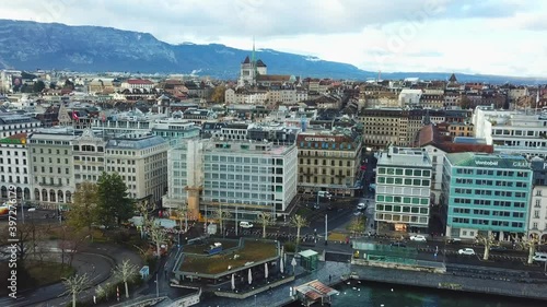 Aerial view of Geneva and aerial view of water jet fountain. Drone flying over the picturesque cityscape 