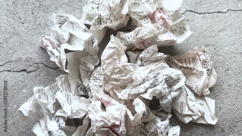 Close-up of a large number of crumpled receipts from stores. The concept of shopping and a large number of purchases 