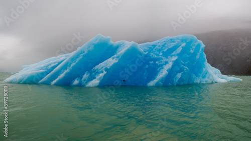 Iceberg floating in the mist