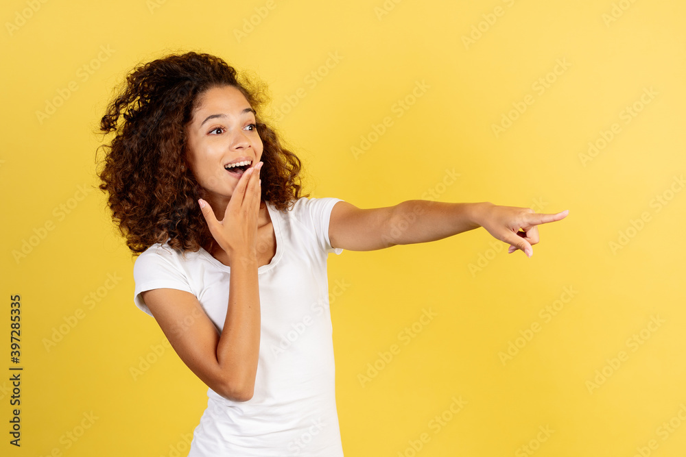 Adult african american woman on yellow copy space background