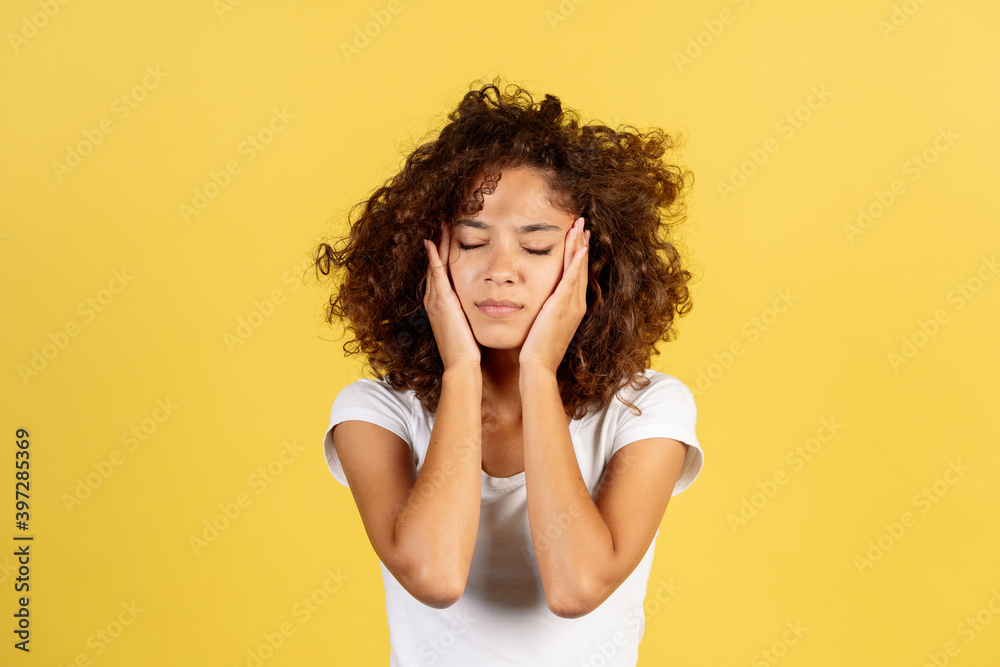 Adult african american woman on yellow copy space background Adult african american woman on yellow copy space background