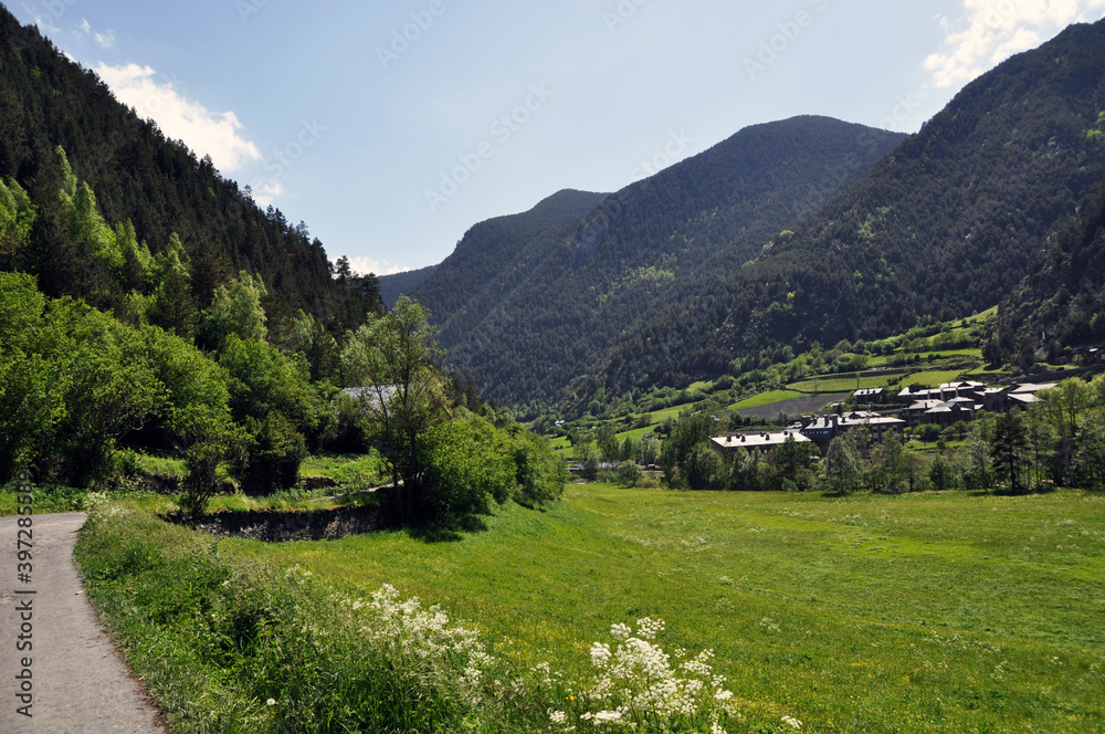 The road along the mountains and the village. Mountain landscapes. Andorra.