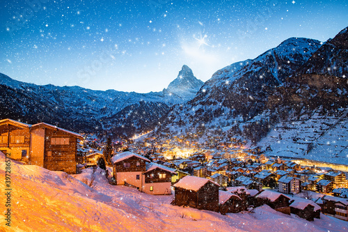 snowing in Zermatt traditional Swiss ski resort under the Matterhorn photo