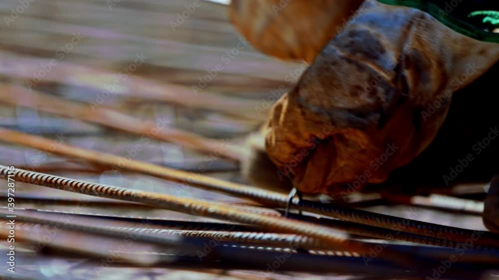 Using wire to tie a rebar grid for a strong concrete foundation low