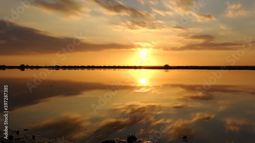 Amazing sunset in marshes of nature reserve Marismas del Odiel in Huelva, Andalusia, Spain