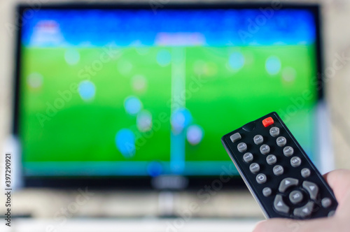 TV remote in your hand when you turn on a football match