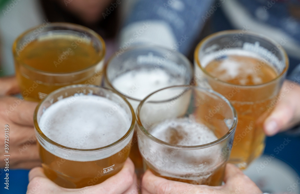 cheerful company with glasses of beer in their hands cheerful company with glasses of beer in their hands