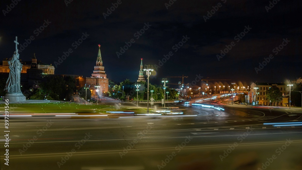 Moscow city road at night with view on Kremlin, night road in the centre of capital. City traffic near Moscow statue of Prince Vladimir and Kremlin