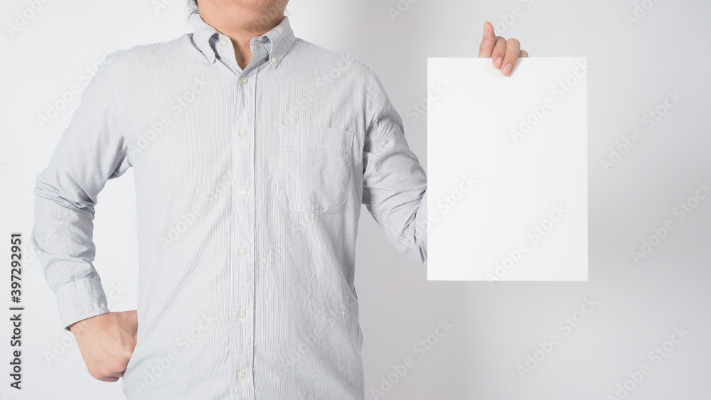 Empty space for text.Blank A4 paper holding by Male asian and wear shirt on white background. Empty space for text.Blank A4 paper holding by Male asian and wear shirt on white background.
