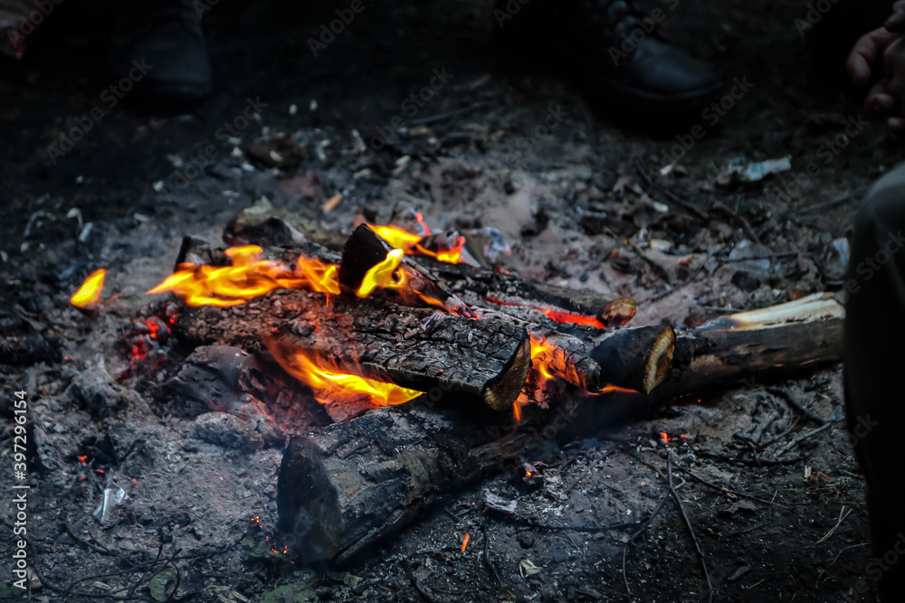 Red fire in a black sand Red fire in a black sand