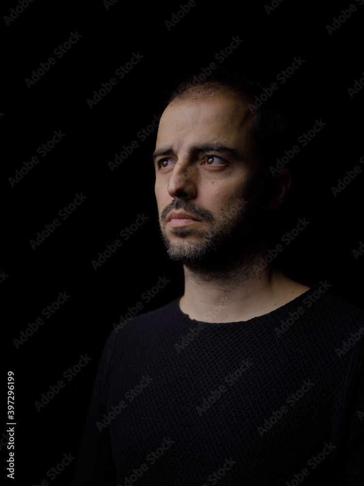 Portrait of a man in a dark environment 