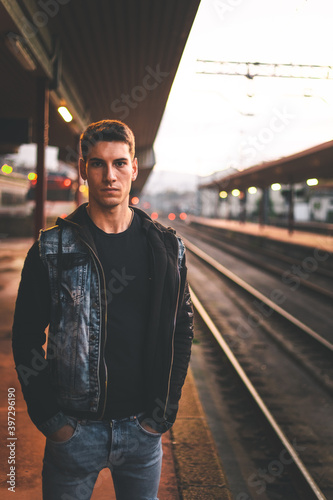 Young man waiting at the train station. © Jorge Argazkiak