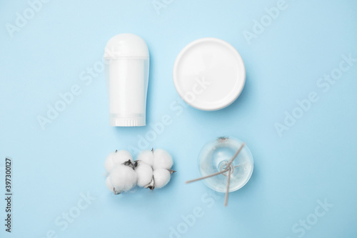personal hygiene product white jars on a blue background  copy space  top view
