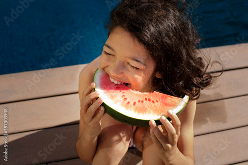 Girl with a watermelon photo