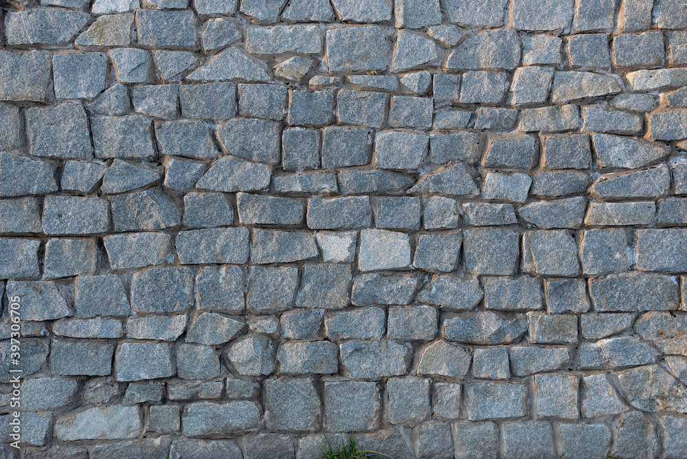 The texture of a solid stone surface created by man. The texture of a solid stone surface created by man.