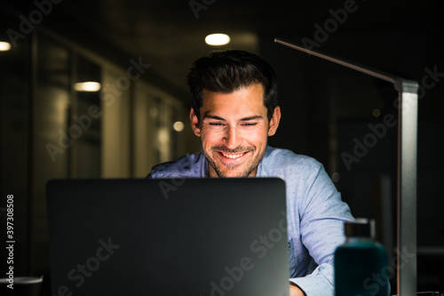 Focused businessman working late in office