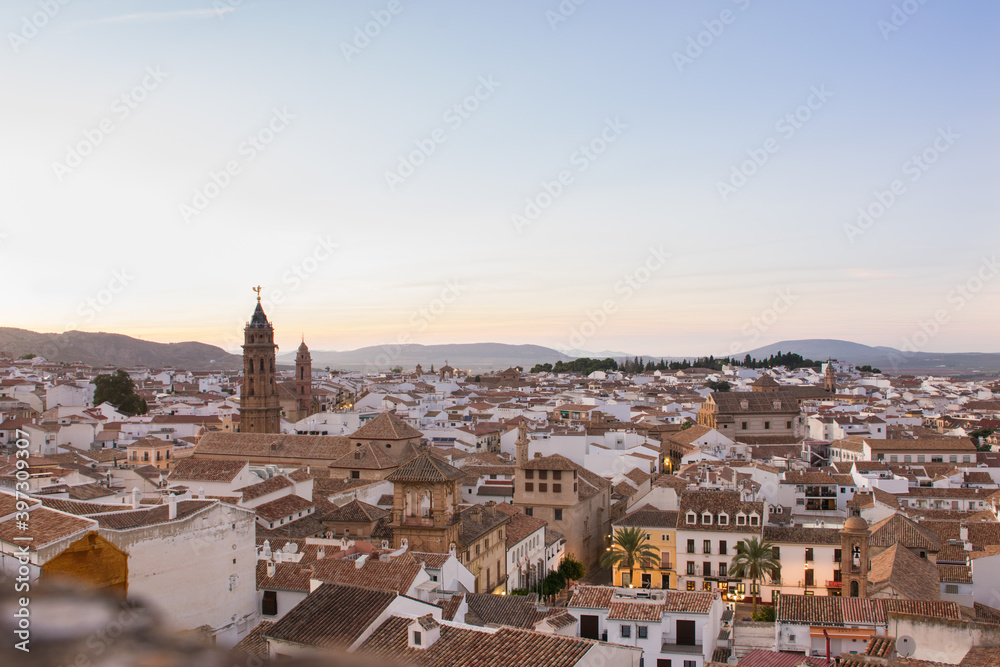 Antequera town seen from above. Andalusian village with the white houses at sunset. Malaga, Andalusian, Spain.
