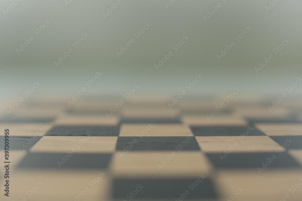 Wood chess board on a glass table background
