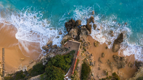 Aerial view of the sand beach of Caños de Meca with blue water. Top view, amazing natural beach background. Atlantic Ocean in Caños de Meca, Cádiz, Andalusia, Spain.