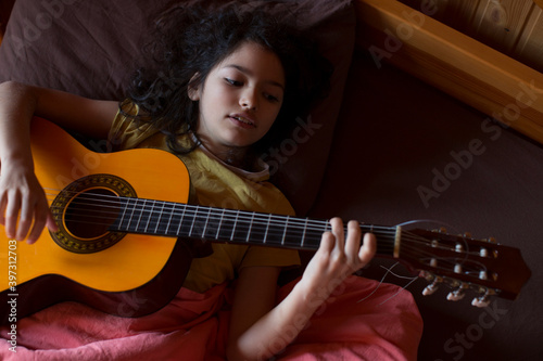 Teen girl with a guitar