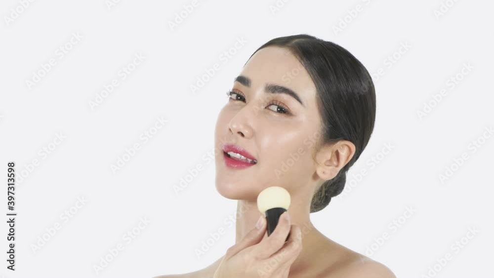 Beauty concept of 4k Resolution. Asian girls are using a sponge to apply foundation on their face. Beauty concept of 4k Resolution. Asian girls are using a sponge to apply foundation on their face.