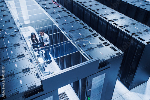 High angle view of technicians working in server room