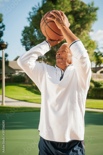 Black man playing basketball photo