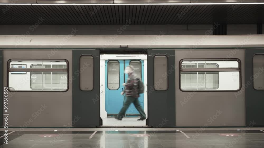 A man in a mask walks on an empty subway train. The COVID-19 epidemic. Self-isolation in the city. A man in a mask walks on an empty subway train. The COVID-19 epidemic. Self-isolation in the city.