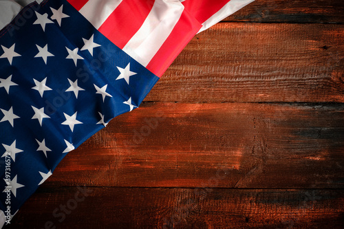 American flag on brown wooden rustic background, banner design, space for text