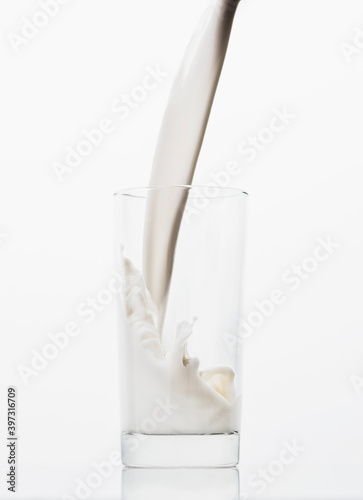 Milk pouring into glass