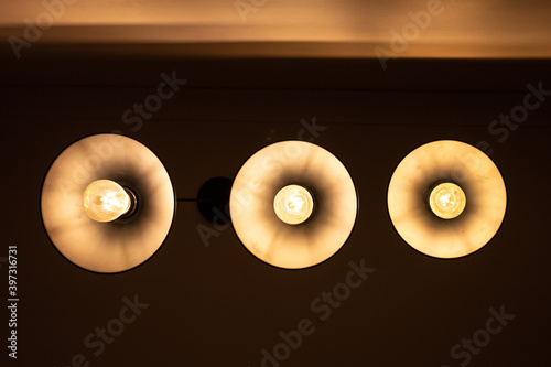 Three round lamps on the ceiling, bottom view