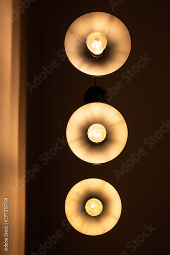 Three round lamps on the ceiling, bottom view