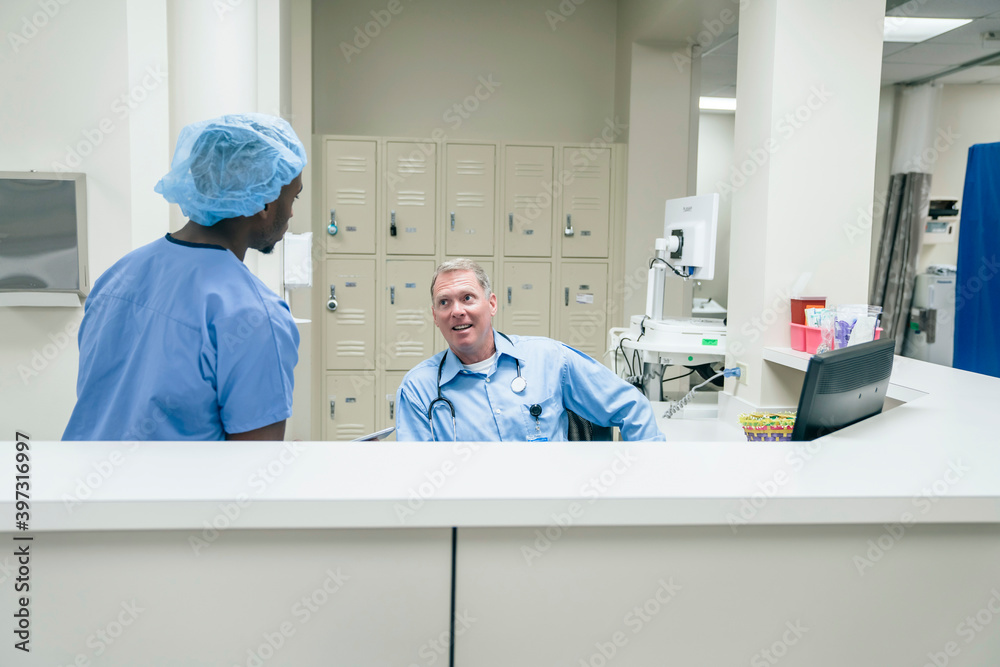 Doctor and nurse talking in hospital Doctor and nurse talking in hospital
