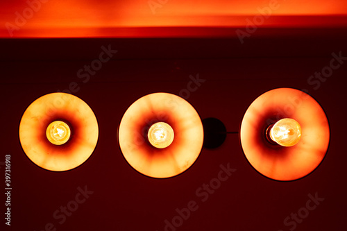 Three round lamps on the ceiling, bottom view