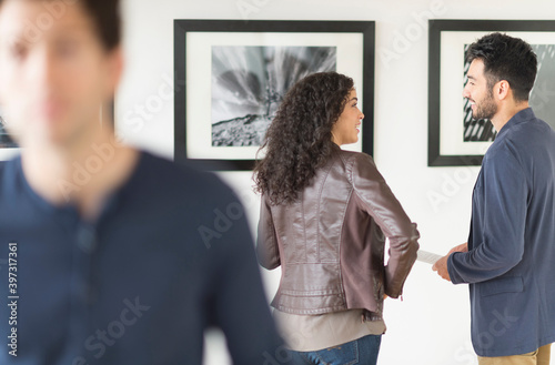 Couple admiring art in gallery photo