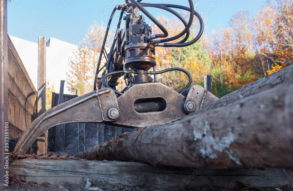 Open jaws of a crane grab loader tractor machine Open jaws of a crane grab loader tractor machine