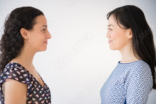 Women smiling at each other photo
