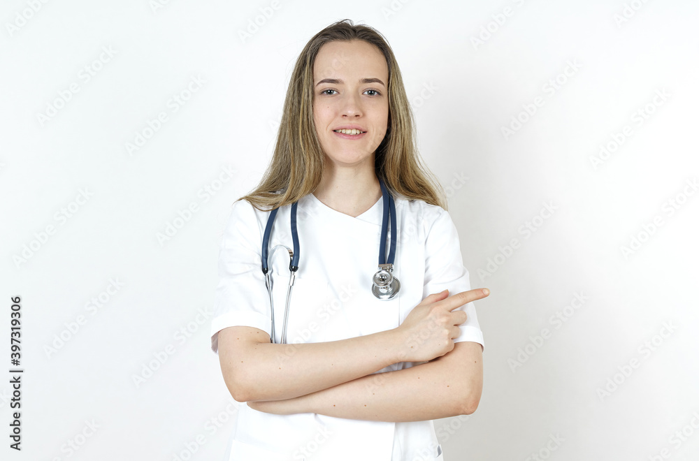 Medicine and health concept. Doctor pointing to the side. Medicine and health concept. Doctor pointing to the side.
